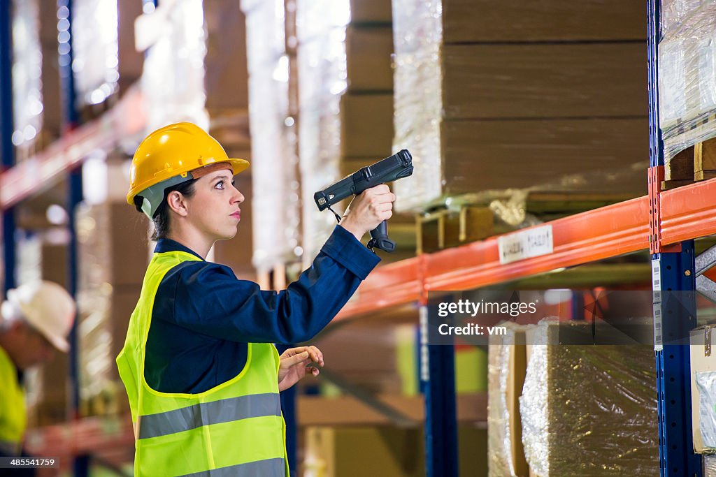 Warehouse Employee Scanning Boxes