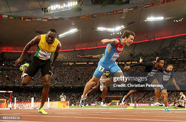 Sergey Shubenkov of Russia crosses the finish line to win gold in the Men's 110 metres hurdles final ahead of Hansle Parchment of Jamaica during day...