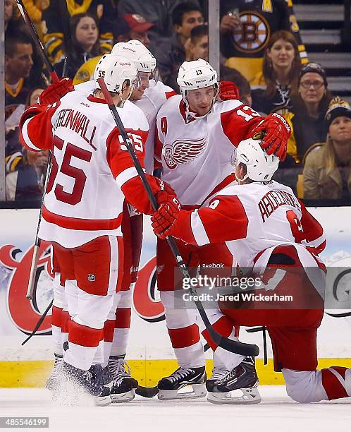 Pavel Datsyuk of the Detroit Red Wings celebrates his goal in the third period with teammate Justin Abdelkader against the Boston Bruins in Game One...