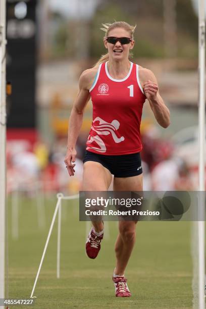Melissa Breen of Canberra competes in State of Victoria Strickland Family Women's Gift Heat 1 during the 2014 Stawell Gift meet at Central Park on...