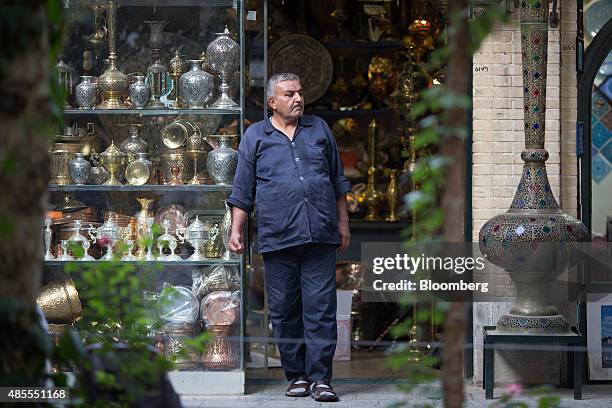 Storekeeper waits for customers outside his metalware store in Nagshe Jahan bazaar in Isfahan, Iran, on Thursday, Aug. 27, 2015. Iran expects its...