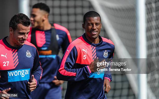 Georginio Wijnaldum warms up with Steven Taylor during the Newcastle United Training session at The Newcastle United Training Centre on August 28 in...