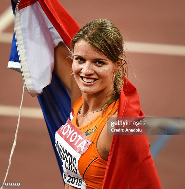 Dafne Schippers of the Netherlands celebrates after winning the gold in the Women's 200 metres final during the '15th IAAF World Athletics...