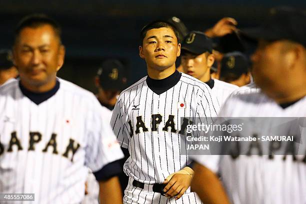 Dh Kotaro Kiyomiya of Japan celebrates after winning in the top half of the seventh inning in the first round game between Japan and Brazil during...