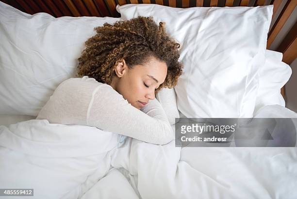 african american woman sleeping in bed - duvet stock pictures, royalty-free photos & images