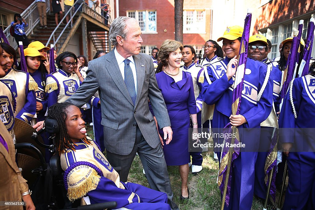 Former President Bush And Laura Bush Visit Charter School In New Orleans