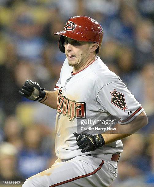 Tony Campana of the Arizona Diamondbacks reacts to his run off a wild pitch from Chris Withrow of the Los Angeles Dodgers to give the Diamondbacks a...
