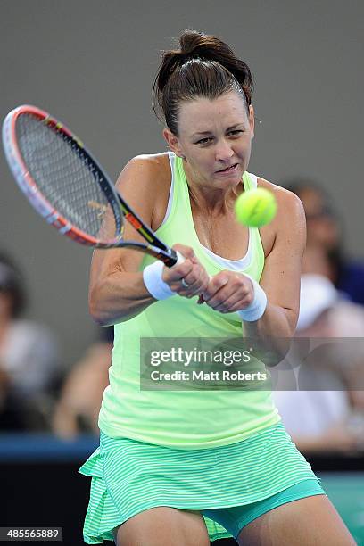 Casey Dellacqua of Australia plays a backhand shot against Angelique Kerber of Germany during the Fed Cup Semi Final tie between Australia and...