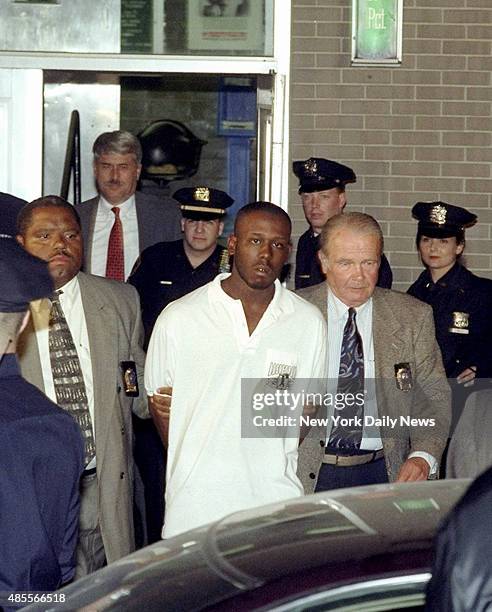 Suspect Corey Arthur, who is charged in the homicide of Teacher Jonathan Levin, is escorted by detectives out of the 81st Precinct.