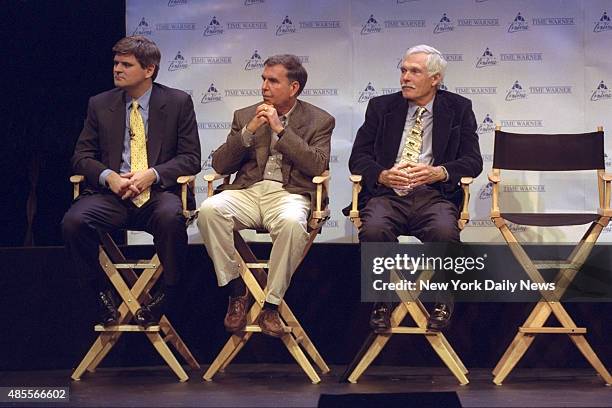 Steve Case, Chairman and CEO of America Online, Gerald Levin, chairman and CEO of Time Warner and Ted Turner, Vice Chairman of Time Warner sit...