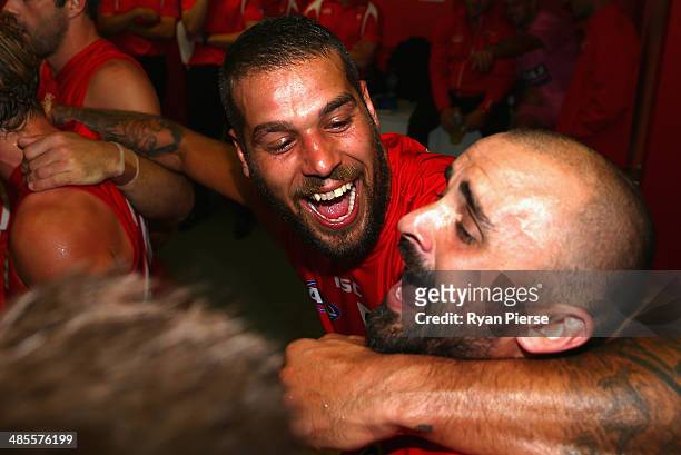 Lance Franklin and Rhyce Shaw of the Swans sings the club song after the round five AFL match between the Sydney Swans and the Fremantle Dockers at...