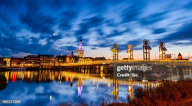 city of kampen at the river ijssel during the night - kampen overijssel stock pictures, royalty-free photos & images