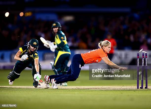 Katherine Brunt of England dives to run out Jess Jonassen of Australia during the 2nd NatWest T20 of the Women's Ashes Series between England and...