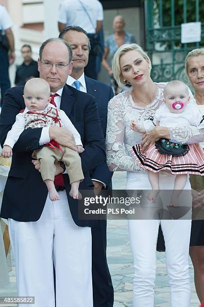 Prince Albert II of Monaco, Prince Jacques, Princess Charlene of Monaco and Princess Gabriella are welcomed by dancers wearing traditional costumes...