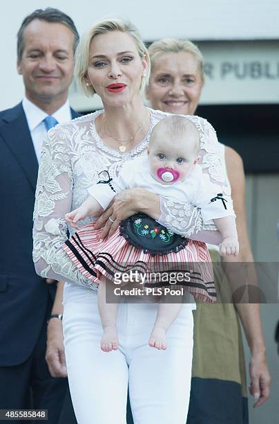 Princess Charlene of Monaco and Princess Gabriella arrive to attend the annual traditional "Pique Nique Monegasque" on August 28, 2015 in Monaco,...