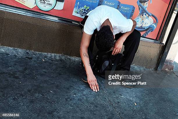 Man pauses while high on K2 or 'Spice', a synthetic marijuana drug, along a street in East Harlem on August 28, 2015 in New York City. New York,...