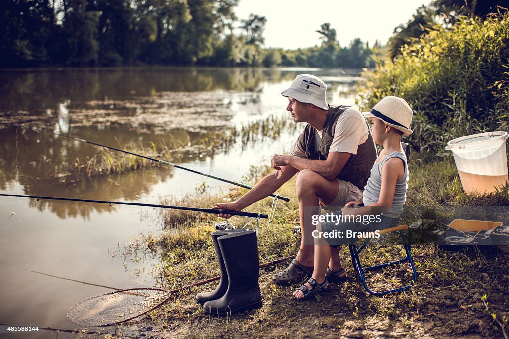 Weekend river fishing of a father and son.