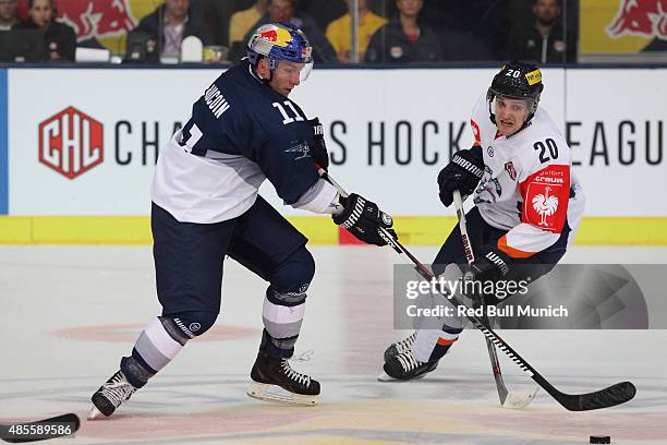 Keith Aucoin of EHC Red Bull Muenchen and Miroslav Macejko of HC Kosice during the Champions Hockey League group stage game between Red Bull Munich...