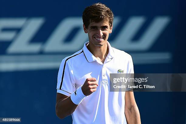 Pierre-Hugues Herbert of France reacts after defeating Steve Johnson during the fifth day of the Winston-Salem Open at Wake Forest University on...