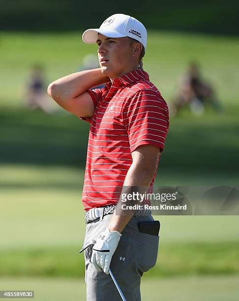 Jordan Spieth of the United States reacts to a shot on the 12th hole during the second round of The Barclays at Plainfield Country Club on August 28,...