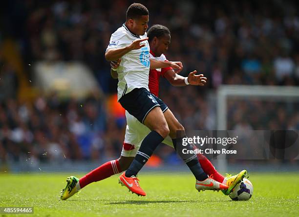 Hugo Rodallega of Fulham and Ezekiel Fryers of Tottenham Hotspur battle for the ball during the Barclays Premier League match between Tottenham...