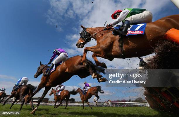 Ben Cee Pee M ridden by Craig Gallagher clears a fence during The £3 Million totescoop6 Today Handicap Hurdle Race at Haydock Racecourse on April 19,...