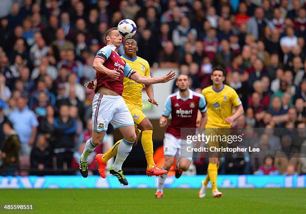 Kagisho Dikgacoi of Crystal Palace and Kevin Nolan of West Ham compete for the ball during the Barclays Premier League match between West Ham United...