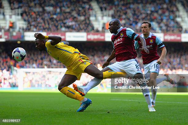 Yannick Bolasie of Crystal Palace and Pablo Armero of West Ham compete for the ball during the Barclays Premier League match between West Ham United...