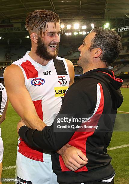 Josh Bruce of the Saints celebrates winning with assistant coach Lindsay Gilbee during the round five AFL match between the Essendon Bombers and the...