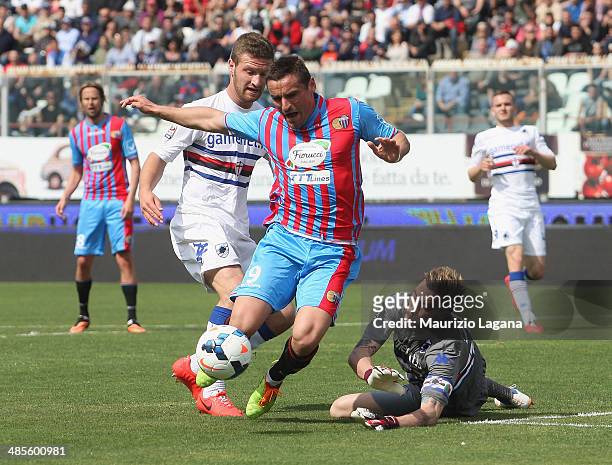 Gonzalo Bergessio of Catania competes for the ball with Daniele Fiorillo of Sampdoria during the Serie A match between Calcio Catania and UC...