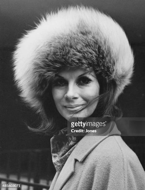 Trans model April Ashley wearing a fur hat, 12th February 1970. Mr Justice Ormrod had recently ruled that her marriage should be annulled as she was...