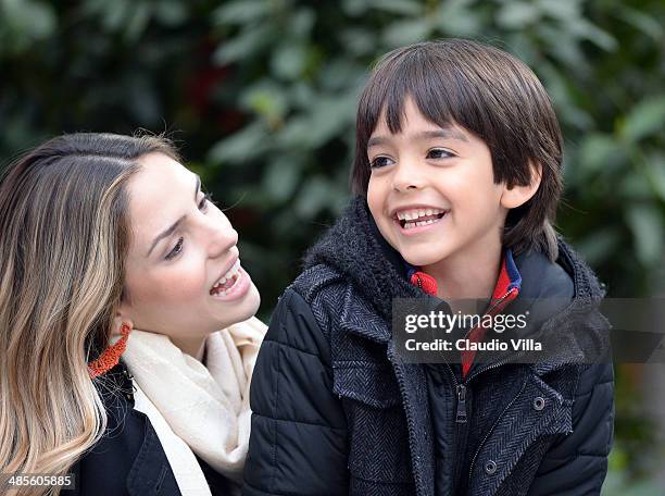 Caroline Celico and Luca Kaka attend the Serie A match between AC Milan and AS Livorno Calcio at San Siro Stadium on April 19, 2014 in Milan, Italy.