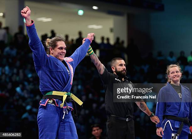 Gabriela Garcia of Brazil celebrates after winning against Janni Larsson of United States in the Women's brown black belt open weight finals during...