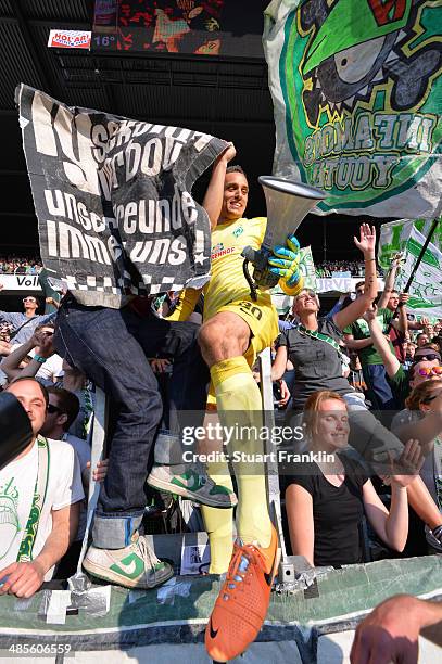 Raphael Wolf of Bremen celebrates with fans at the end of the Bundesliga match between Werder Bremen and 1899 Hoffenheim at Weserstadion on April 19,...