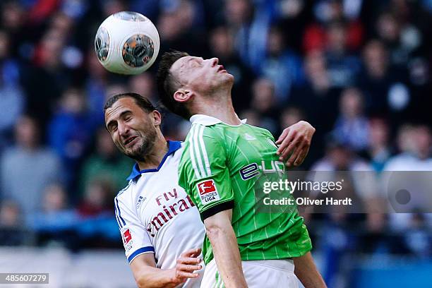 Petr Jiracek of Hamburg and Ivica Olic of Wolfsburg compete for the ball during the Bundesliga match between Hamburger SV and VfL Wolfsburg at Imtech...