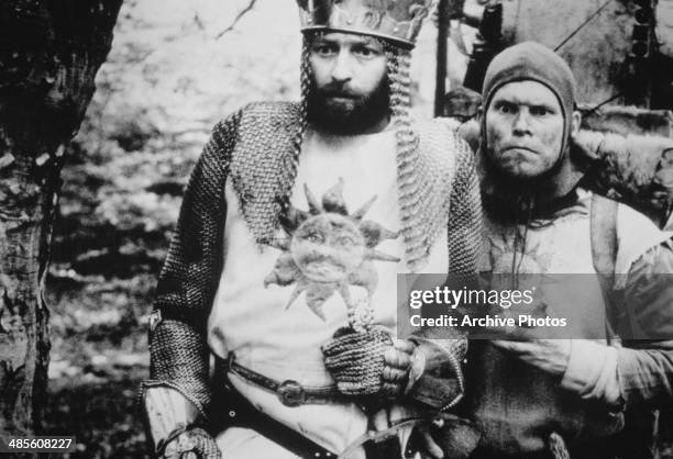 Graham Chapman , as King Arthur, with Terry Gilliam as his sidekick, in a scene from 'Monthy Python and the Holy Grail', directed by Terry Gilliam...