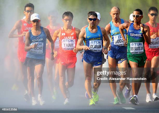 Andres Chocho of Ecuador, Takayuki Tanii of Japan, Igor Glavan of Ukraine and Mario Jose Dos Santos Jr of Brazil compete in the Men's 50km Race Walk...