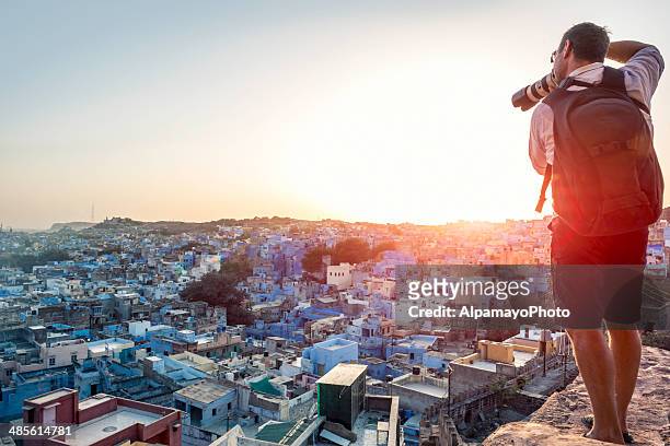 photographer taking image of the blue city rooftops, jodhpur - tourism stock pictures, royalty-free photos & images
