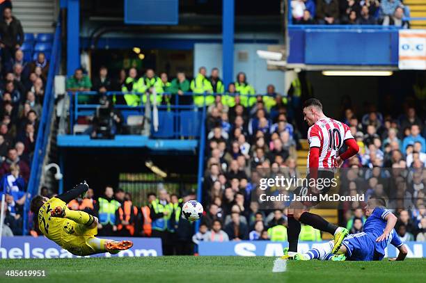 Connor Wickham of Sunderland scores past Mark Schwarzer the Chelsea goalkeeper during the Barclays Premier League match between Chelsea and...