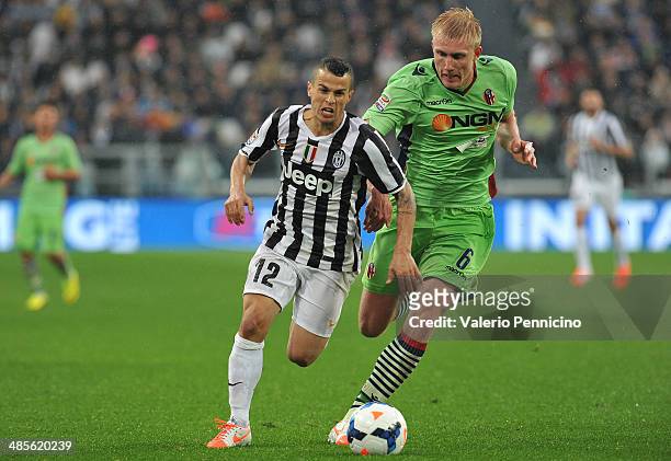 Sebastian Giovinco of Juventus runs of Mikael Antonsson of Bologna FC during the Serie A match between Juventus and Bologna FC at Juventus Arena on...