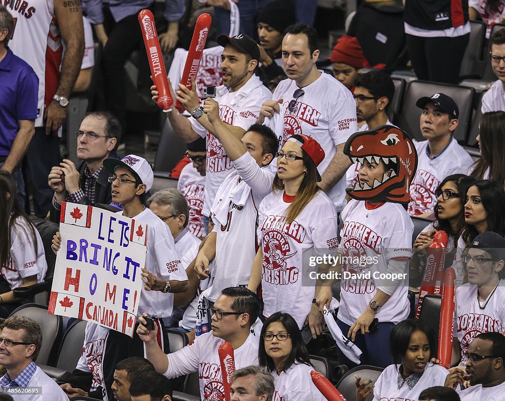 Toronto Raptors fans cheer for their team during the first half
