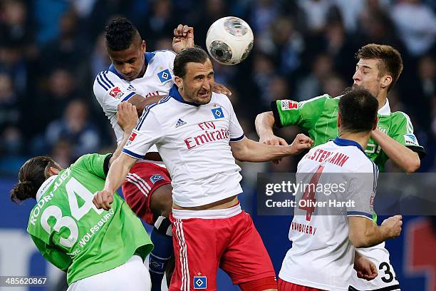 Petr Jiracek of Hamburg and Robin Knoche of Wolfsburg compete for the ball during the Bundesliga match between Hamburger SV and VfL Wolfsburg at...