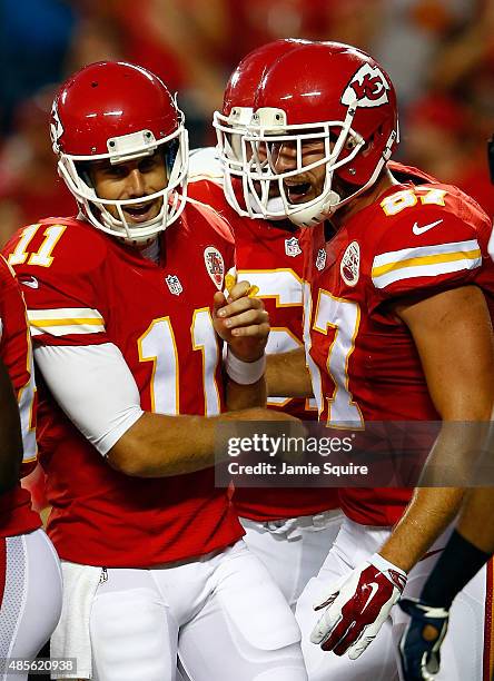 Quarterback Alex Smith of the Kansas City Chiefs celebrates with tight end Travis Kelce after a touchdown during the preseason game against the...