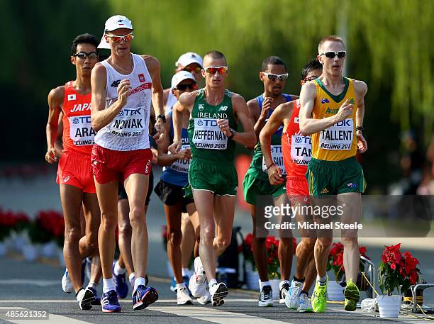 Lukasz Nowak of Poland, Robert Heffernan of Ireland and Jared Tallent of Australia compete in the Men's 50km Race Walk during day eight of the 15th...