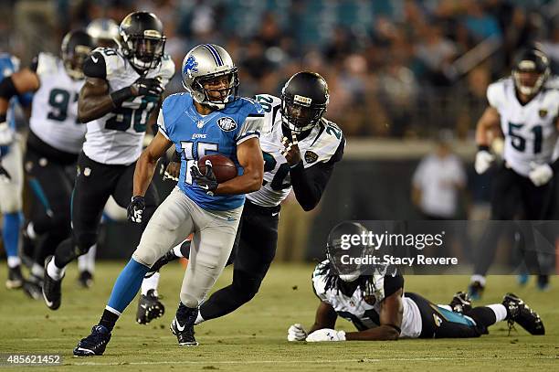 Golden Tate of the Detroit Lions is pursued by Craig Loston of the Jacksonville Jaguars during the first quarter of a preseason game at EverBank...