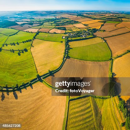 Picturesque patchwork quilt farmland aerial view over fields rural villages Picturesque patchwork quilt farmland aerial view over fields rural villages