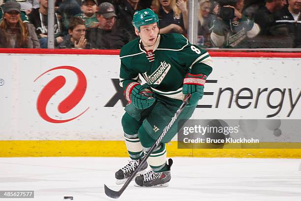 Cody McCormick of the Minnesota Wild skates with the puck during the game against the Nashville Predators on April 13, 2014 at the Xcel Energy Center...