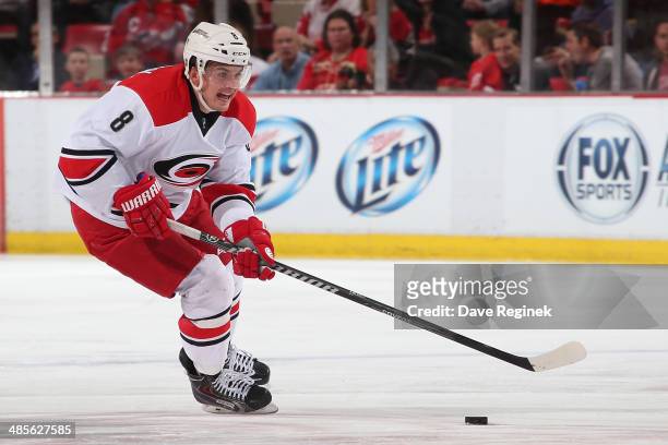Andrei Loktionov of the Carolina Hurricanes skates up ice with the puck against the Detroit Red Wings during an NHL game on April 11, 2014 at Joe...