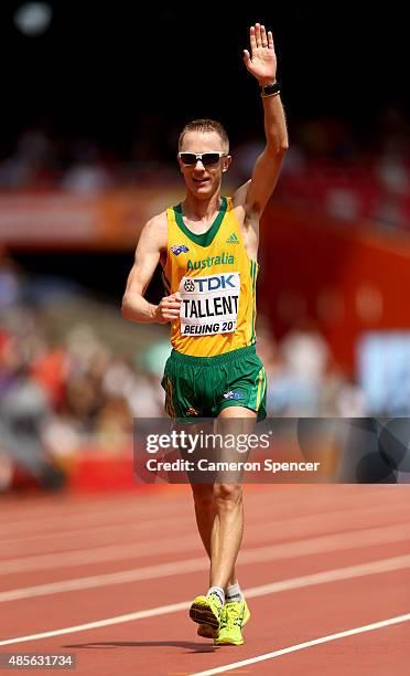 Jared Tallent of Australia celebrates after crossing the finish line to win silver in the Men's 50km Race Walk final during day eight of the 15th...