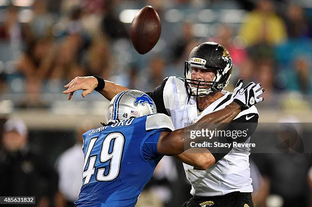 Chad Henne of the Jacksonville Jaguars loses the ball after being hit by Julian Stanford of the Detroit Lions during the third quarter of a preseason...